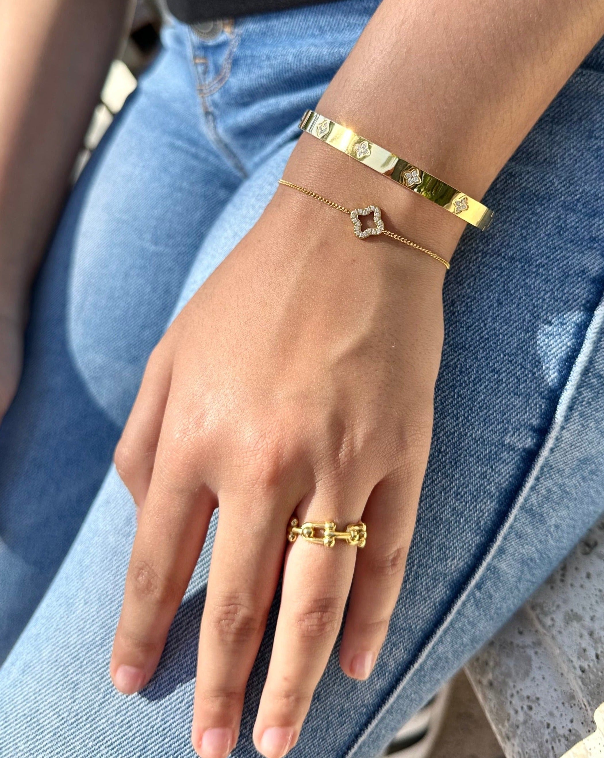 gold hardwear ring paired with 2 gold bracelets