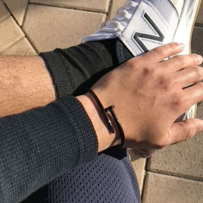 mens casual everyday jet black nail bracelet for him with white new balance sneakers