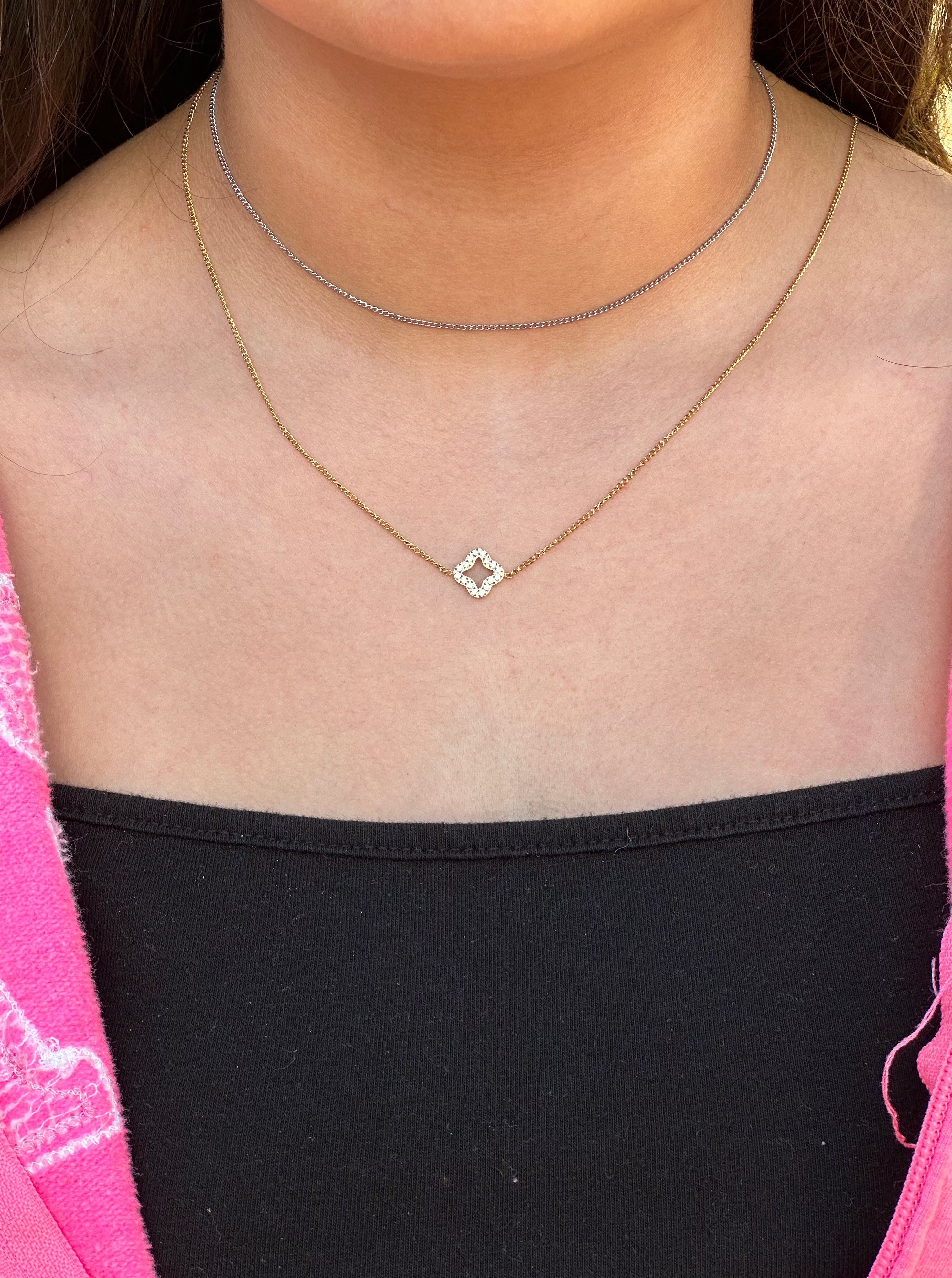 silver choker paired with gold diamond necklace