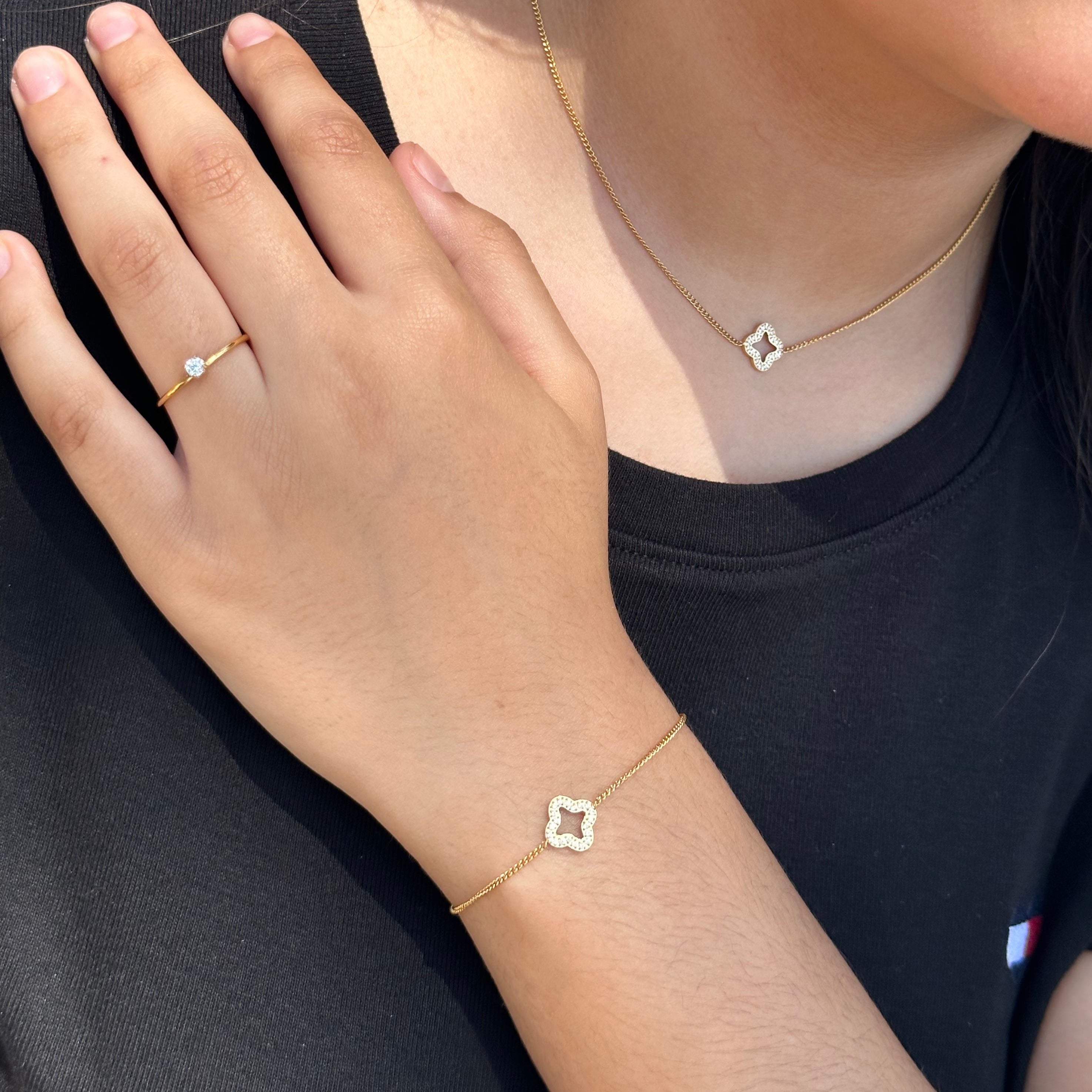 womens gold jewlery set with black shirt