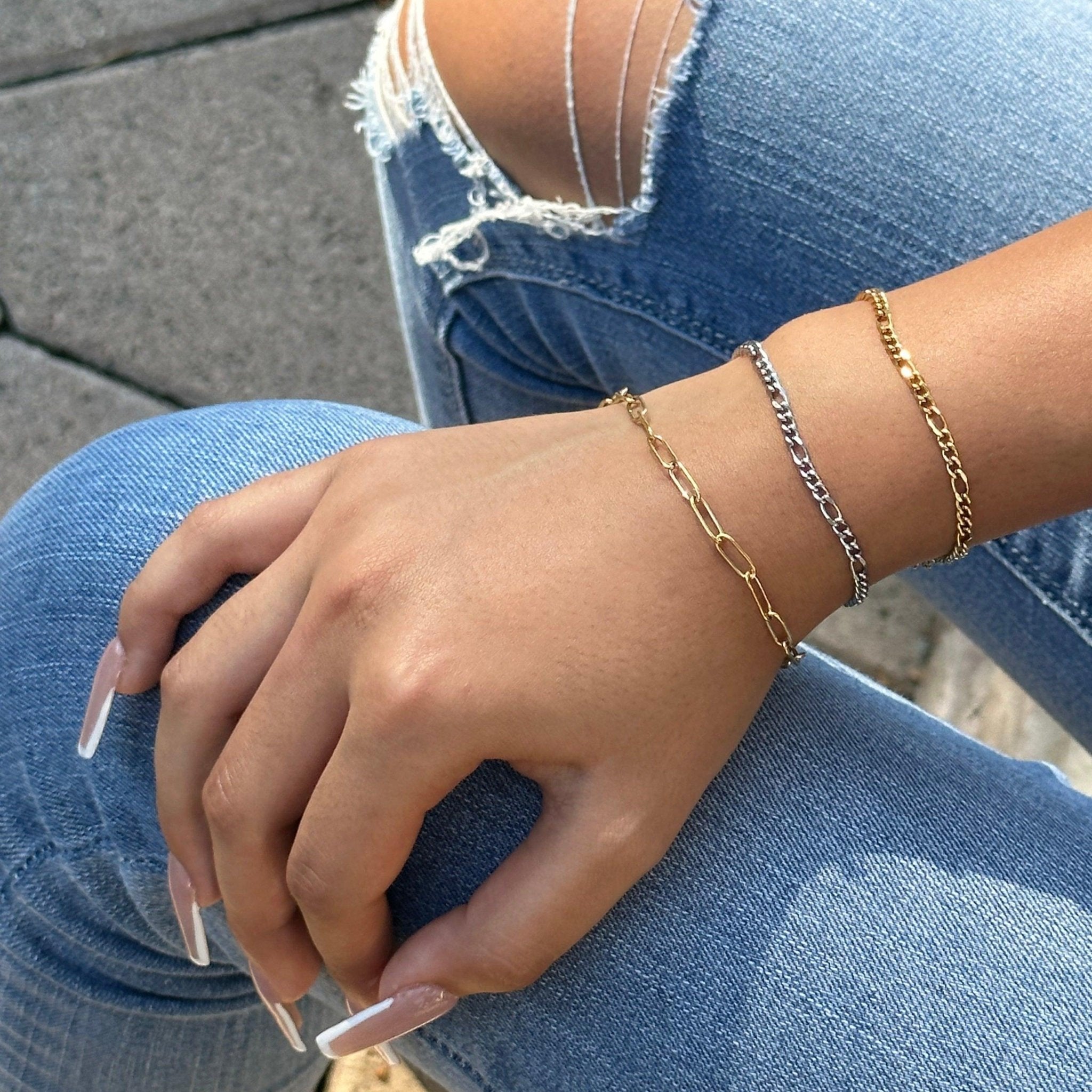 Paperclip chain bracelet stacked with 2 figaro bracelets