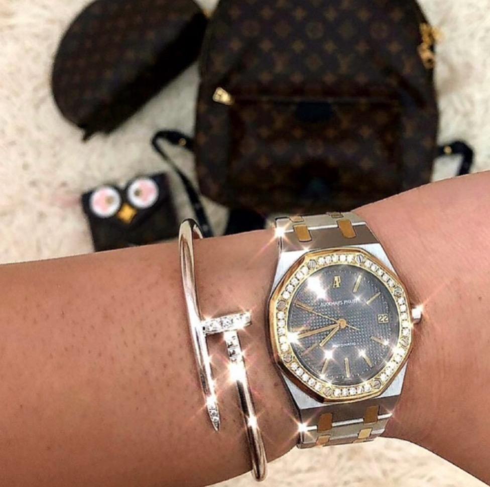Men's silver nail bracelet with embedded gems and a watch stack