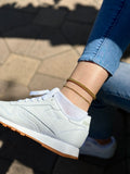 White Reebok Sneakers Gold 1 oak jewelry anklets and denim jeans