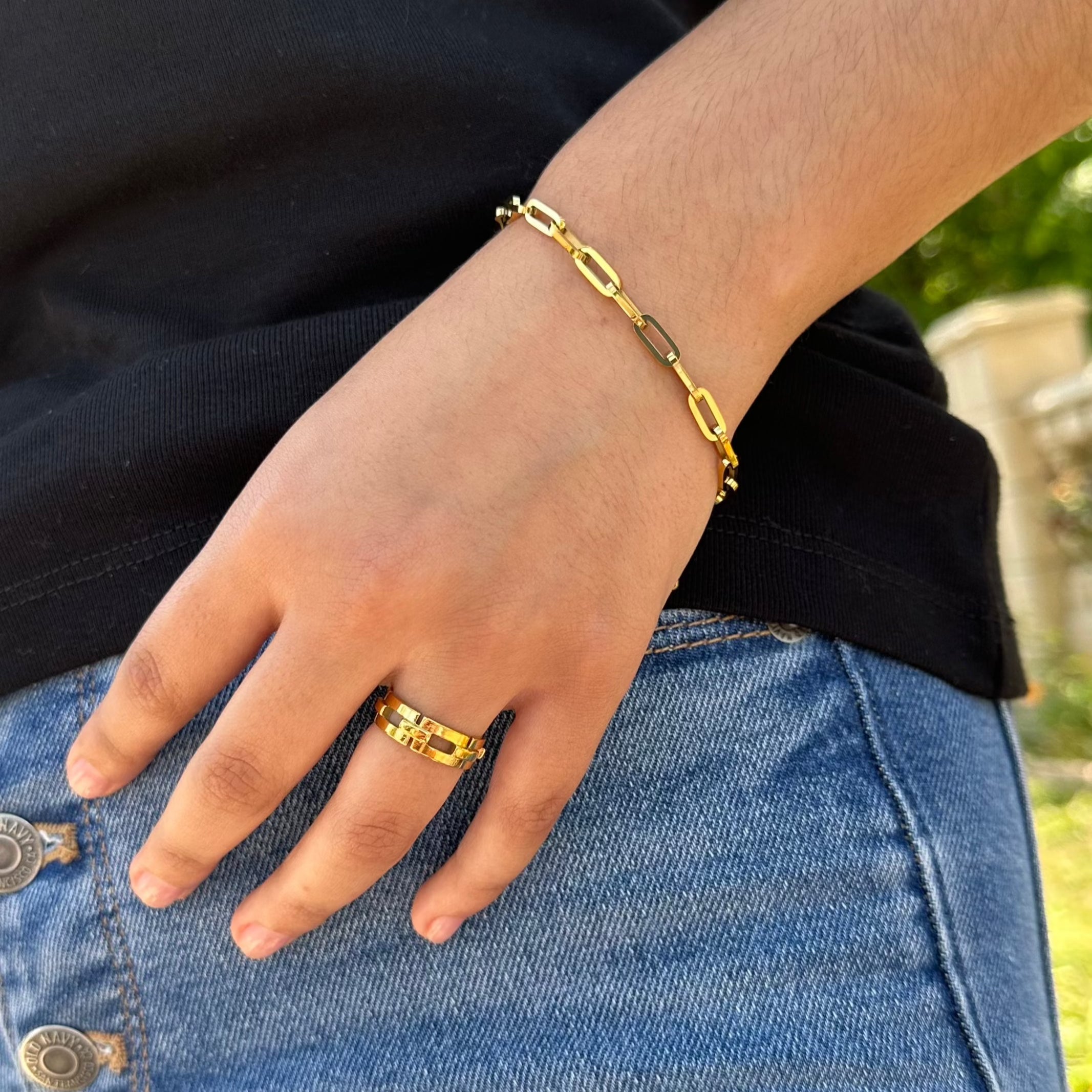 gold ring and paperclip chain bracelet