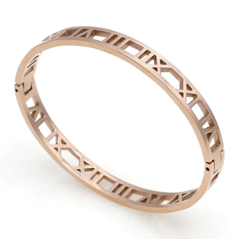 Rose gold bracelet with Roman numerals carved into the surface